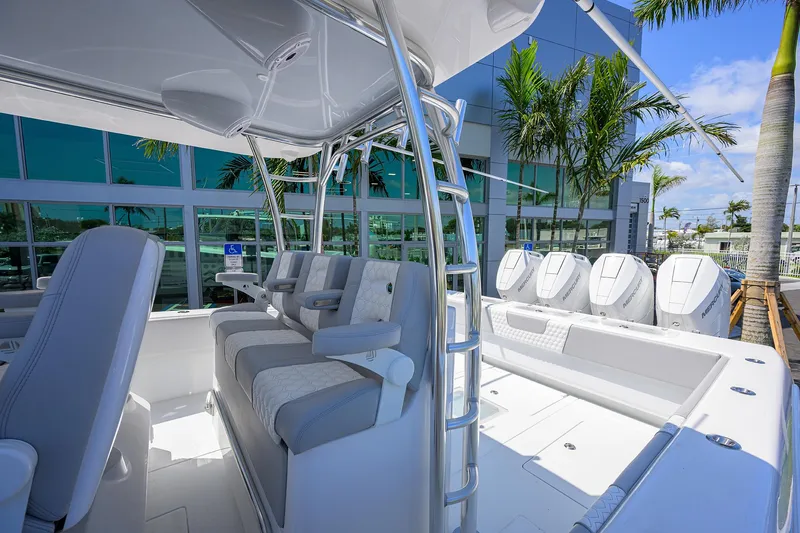 Slide: The Image of 2025 Contender 44ST boat interior with seating and multiple outboard engines. - 23