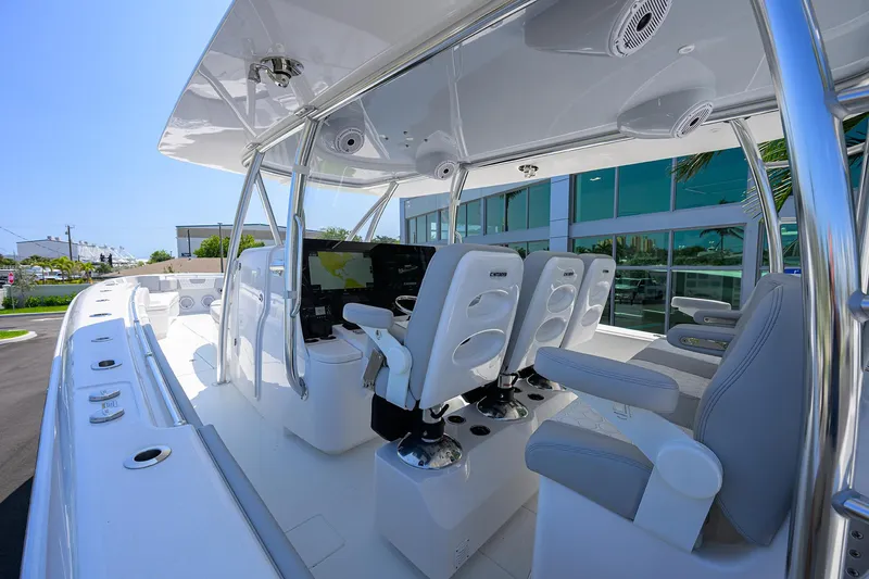 Slide: The Image of 2025 Contender 44ST boat interior with modern seating and navigation equipment. - 25