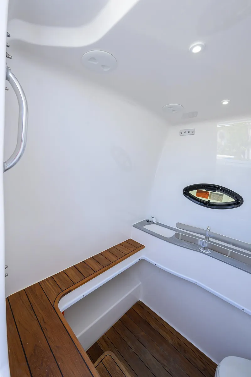 Slide: The Image of 2025 Contender 44ST boat interior with wooden accents and modern fixtures. - 31