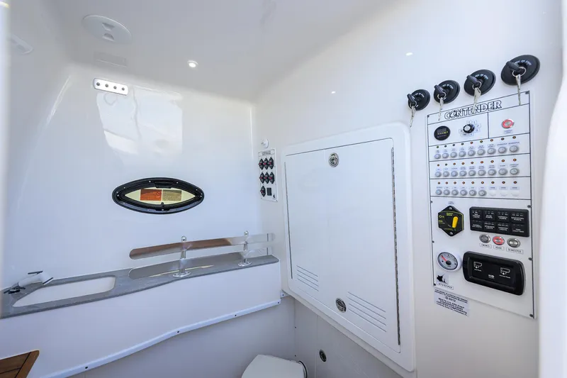 Slide: The Image of 2025 Contender 44ST boat interior with control panel and sink area. - 32