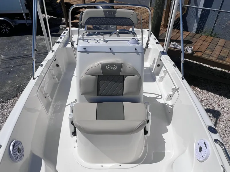 Slide: The Image of 2025 Key West 1720 Center Console boat interior with seating and console view. - 12