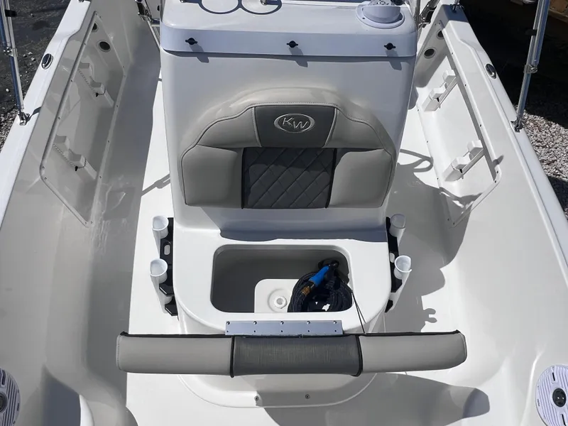 Slide: The Image of 2025 Key West 1720 Center Console boat interior with seating and storage. - 13