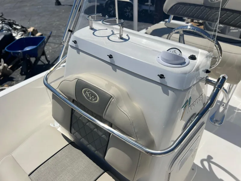 Slide: The Image of 2025 Key West 1720 Center Console boat interior with steering and cup holders. - 17