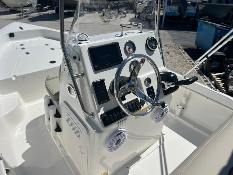 Slide: The Image of 2025 Key West 1720 Center Console boat dashboard with steering wheel and controls. - 18