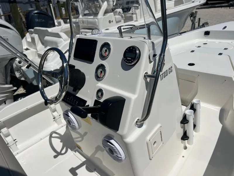 Slide: The Image of 2025 Key West 1720 Center Console boat interior with steering wheel and control panel. - 20