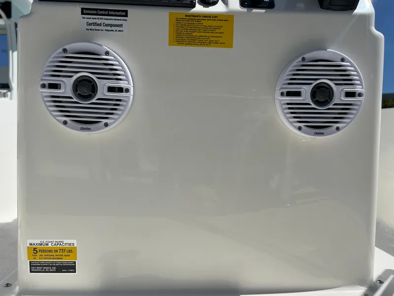 Slide: The Image of 2025 Key West 1720 Center Console boat dashboard with dual marine speakers. - 21