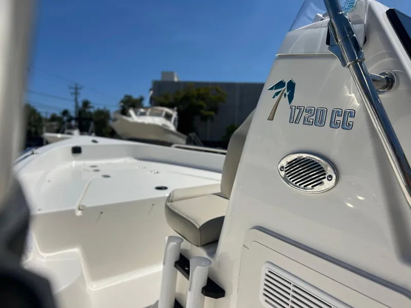 Slide: The Image of 2025 Key West 1720 Center Console boat, white exterior, close-up view of seating and console. - 23