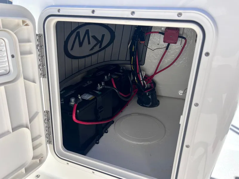 Slide: The Image of 2025 Key West 1720 Center Console battery compartment with wiring and components. - 24