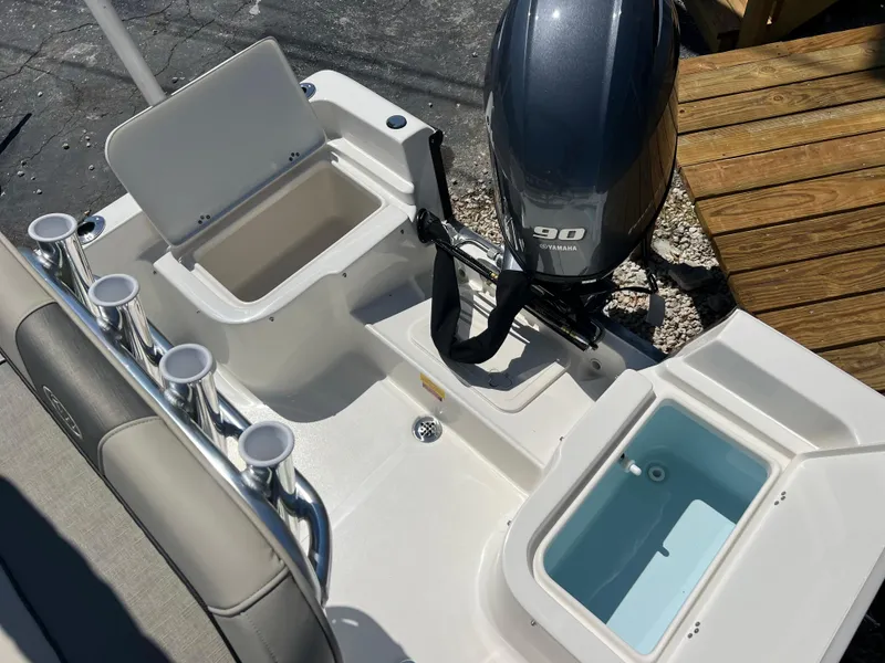 Slide: The Image of 2025 Key West 1720 Center Console boat with motor and storage compartments. - 27