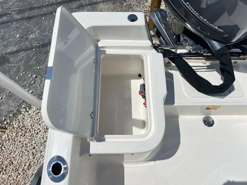Slide: The Image of 2025 Key West 1720 Center Console boat with open storage compartment. - 28