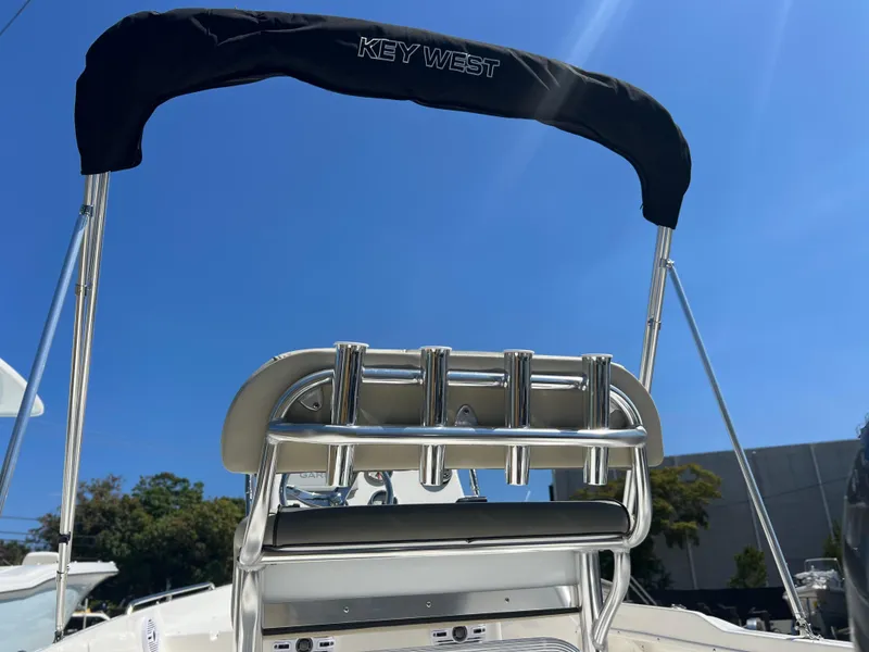 Slide: The Image of 2025 Key West 1720 Center Console boat with T-top under clear blue sky. - 33