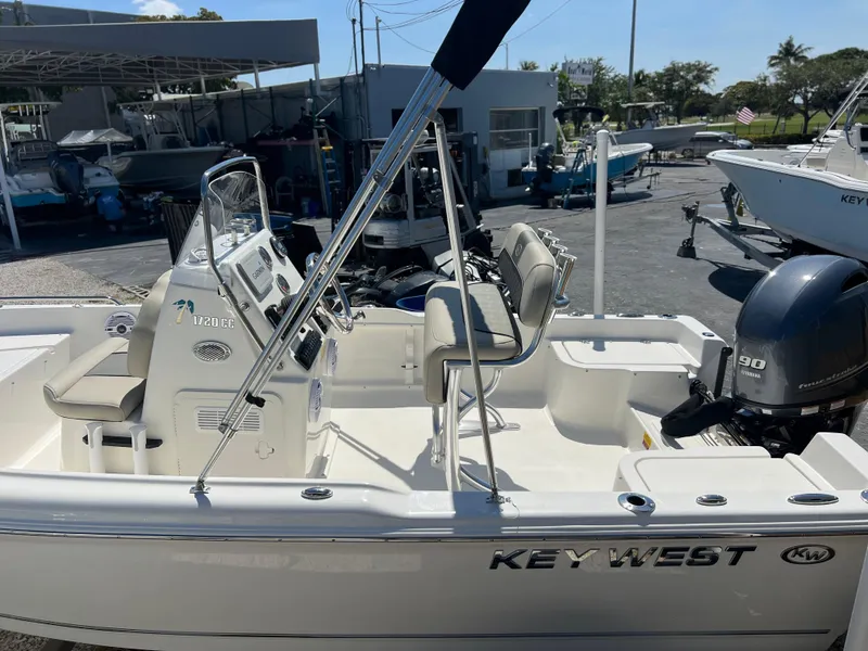 Slide: The Image of 2025 Key West 1720 Center Console boat with Yamaha engine, docked at a marina. - 34