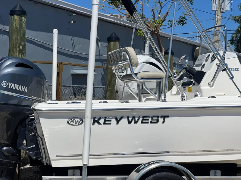 Slide: The Image of 2025 Key West 1720 Center Console boat with Yamaha engine, docked outdoors. - 6