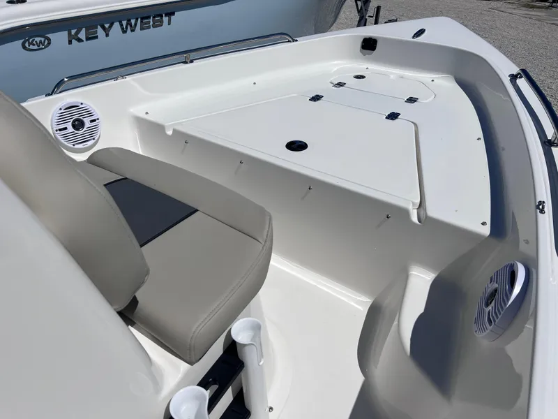 Slide: The Image of 2025 Key West 1720 Center Console boat interior with seating and storage compartments. - 7
