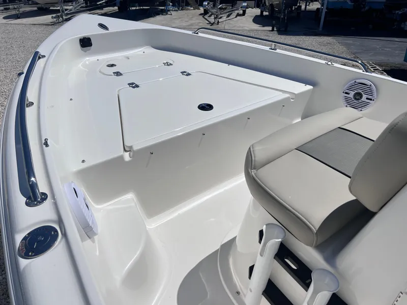 Slide: The Image of 2025 Key West 1720 Center Console boat interior with seating and storage compartments. - 8