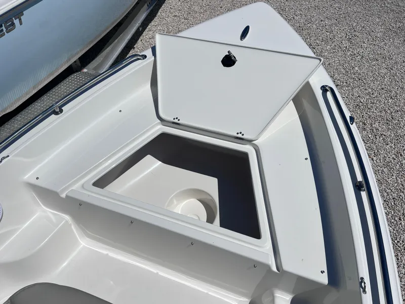 Slide: The Image of 2025 Key West 1720 Center Console boat with open storage compartment on deck. - 9