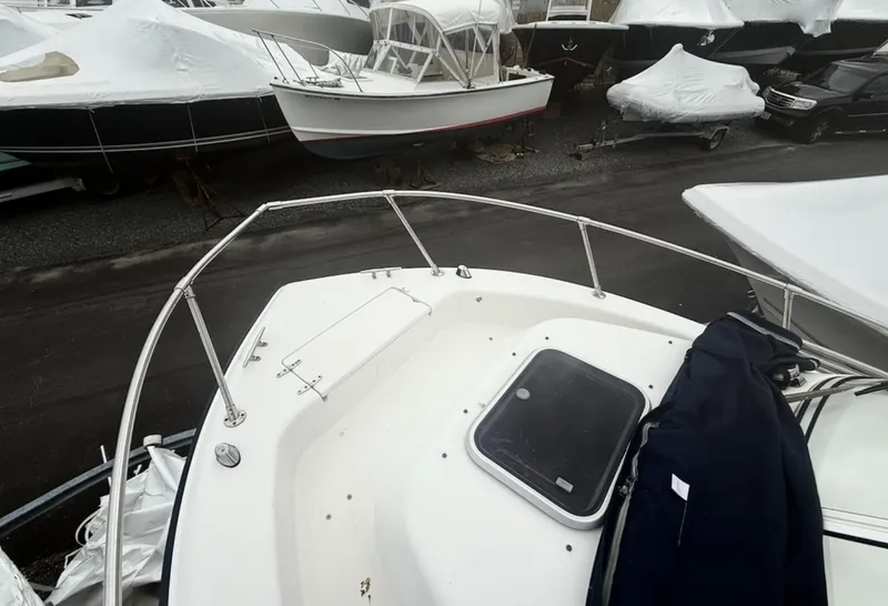 Slide: The Image of Bow view of a 2000 Grady-White Adventure 208 boat in storage. - 10