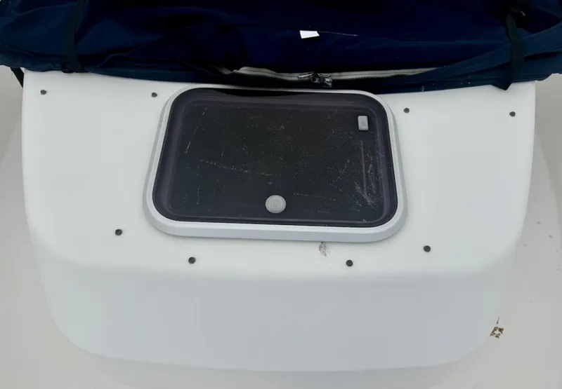 Slide: The Image of 2000 Grady-White Adventure 208 boat compartment with a closed hatch. - 11