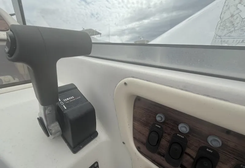 Slide: The Image of Control panel of a 2000 Grady-White Adventure 208 boat with Yamaha throttle. - 15