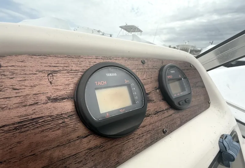 Slide: The Image of Dashboard of 2000 Grady-White Adventure 208 boat with Yamaha tachometer. - 17