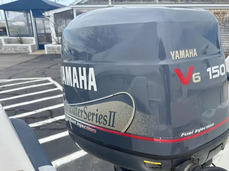 Slide: The Image of Yamaha V6 150 outboard motor on a 2000 Grady-White Adventure 208 boat. - 19