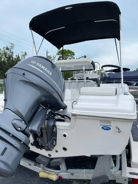 Slide: The Image of 2024 Tidewater 180 CC Adventure boat with Yamaha outboard motor and canopy. - 12