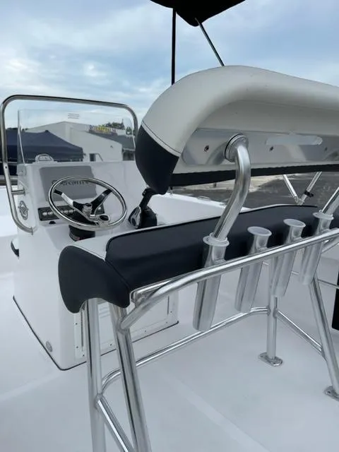 Slide: The Image of 2024 Tidewater 180 CC Adventure boat interior with steering console and seating. - 14