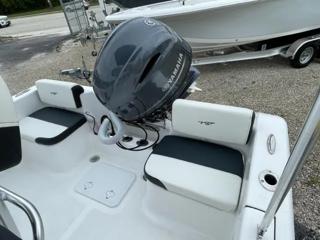 Slide: The Image of 2024 Tidewater 180 CC Adventure boat with Yamaha engine, featuring sleek seating and modern design. - 17