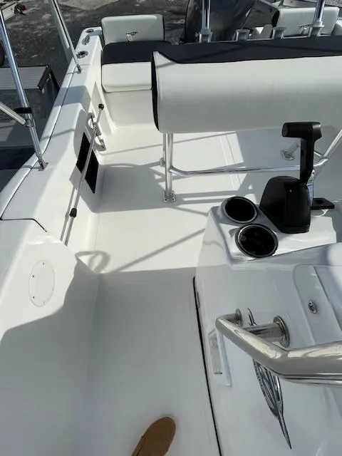 Slide: The Image of 2024 Tidewater 180 CC Adventure boat interior with seating and console details. - 6