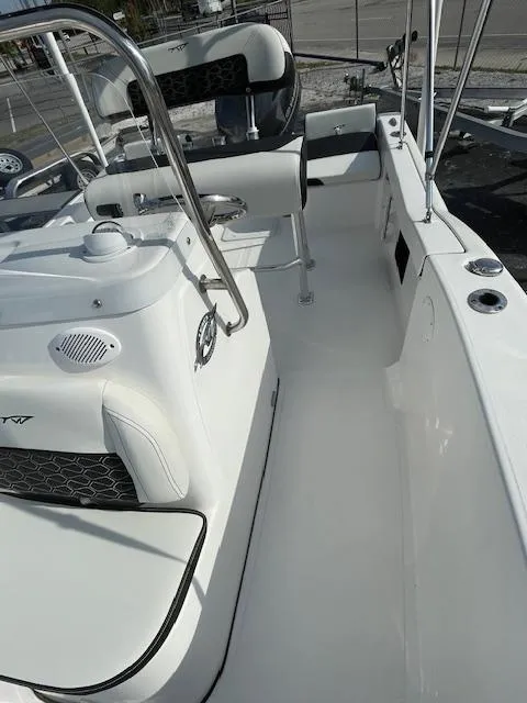 Slide: The Image of 2024 Tidewater 180 CC Adventure boat interior with seating and steering console. - 8