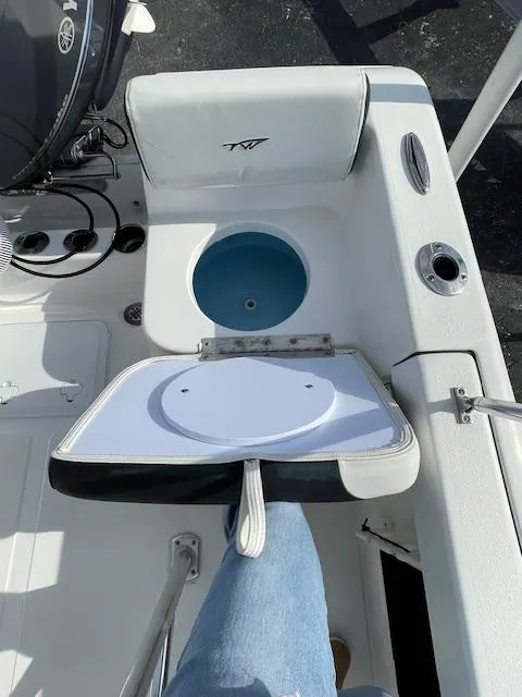 Slide: The Image of 2024 Tidewater 180 CC Adventure boat interior with open storage compartment. - 9