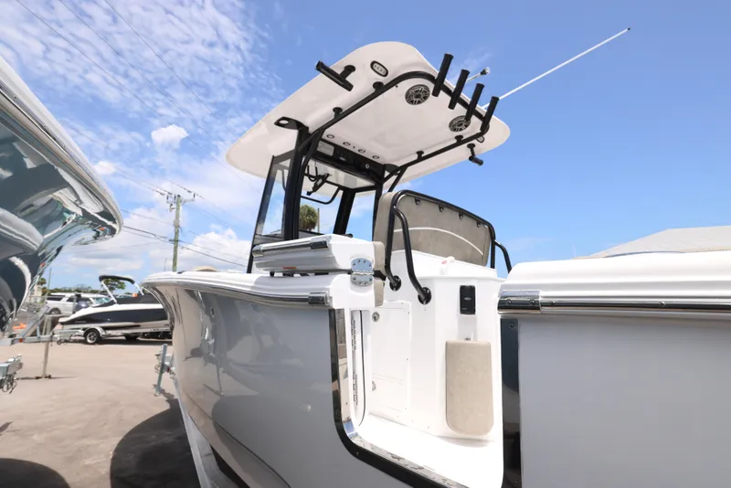 Slide: The Image of 2026 Sea Hunt Ultra 255 SE boat seating with gray upholstery and white deck. - 10