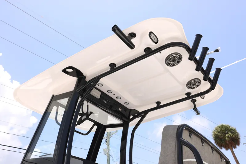 Slide: The Image of 2026 Sea Hunt Ultra 255 SE boat, sleek design, clear sky background. - 11