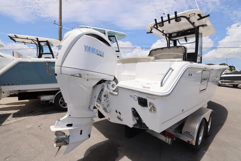 Slide: The Image of 2026 Sea Hunt Ultra 255 SE boat interior with cushioned seating and sleek design. - 14