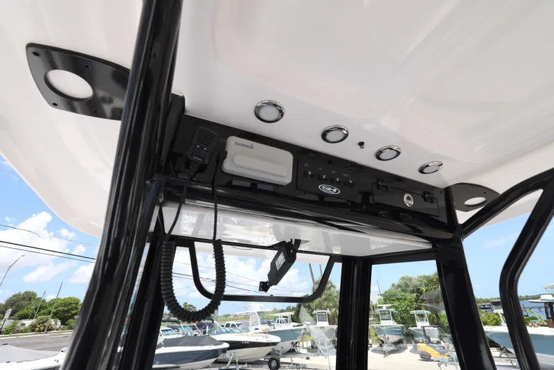 Slide: The Image of 2026 Sea Hunt Ultra 255 SE boat console with electronics and storage compartments. - 23