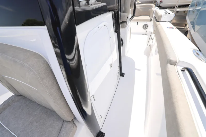 Slide: The Image of 2026 Sea Hunt Ultra 255 SE boat console with electronics and controls. - 24