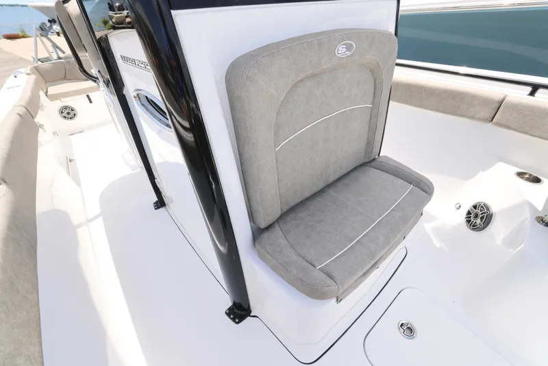 Slide: The Image of 2026 Sea Hunt Ultra 255 SE boat interior with seating and storage compartment. - 25