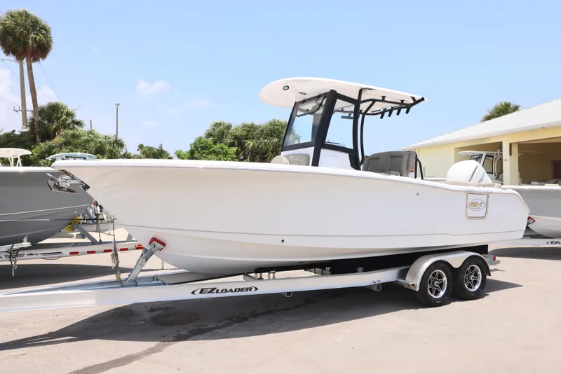 Slide: The Image of 2026 Sea Hunt Ultra 255 SE boat interior with gray seating and sleek design. - 26