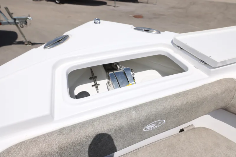 Slide: The Image of 2026 Sea Hunt Ultra 255 SE boat on trailer, parked outdoors. - 28