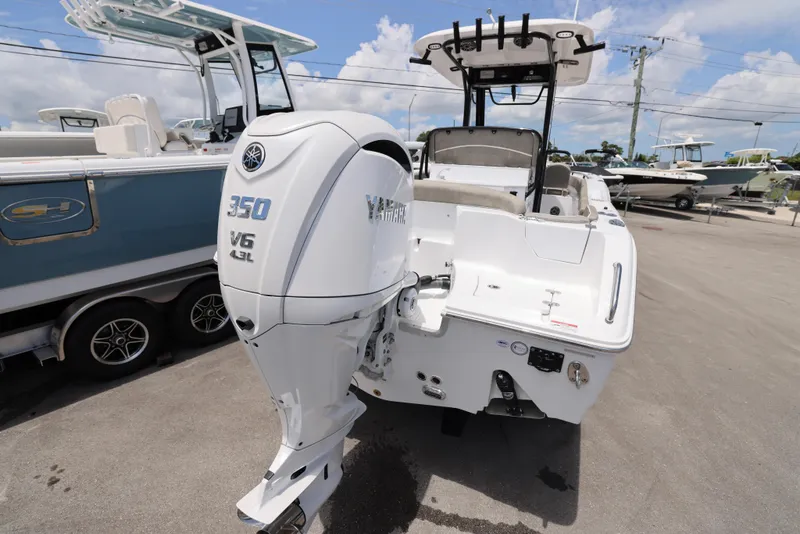 Slide: The Image of 2026 Sea Hunt Ultra 255 SE boat console with Garmin display and steering wheel. - 5