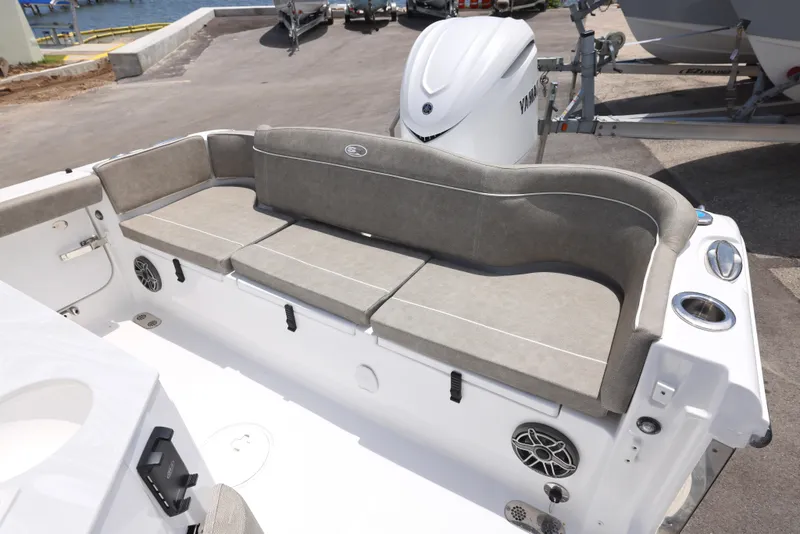 Slide: The Image of T-top of 2026 Sea Hunt Ultra 255 SE boat with rod holders and speakers. - 7