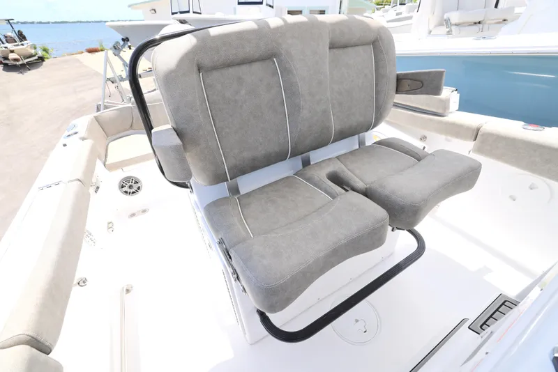 Slide: The Image of 2026 Sea Hunt Ultra 255 SE boat interior bathroom with toilet and storage compartments. - 9