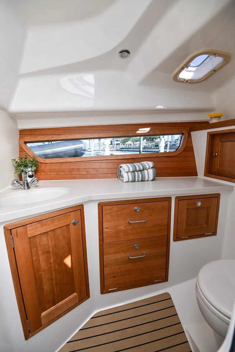 Slide: The Image of Luxurious 2025 MJM 3 yacht interior with wooden cabinetry and modern fixtures. - 29