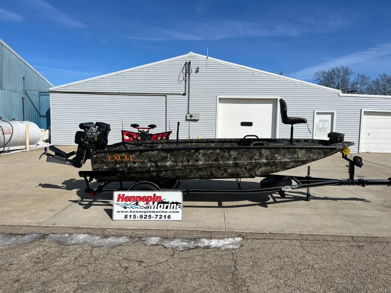 Slide: The Image of 2025 Excel Eclipse boat on trailer at Hemspinn Marine dealership. - 1