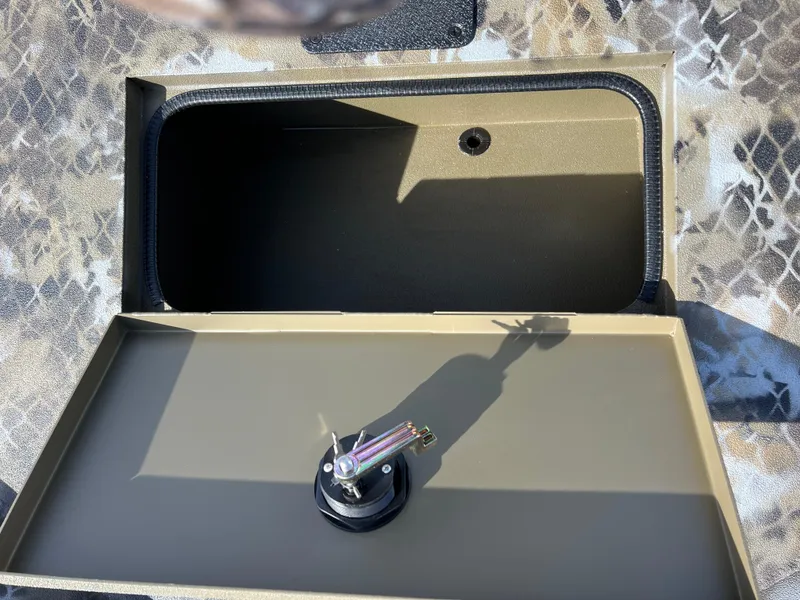 Slide: The Image of Open storage compartment in 2025 Excel Eclipse boat with camouflage pattern. - 12