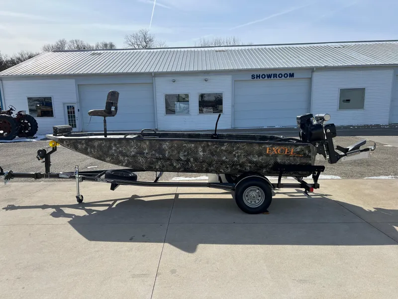 Slide: The Image of 2025 Excel Eclipse boat on trailer outside showroom, featuring camouflage design. - 4