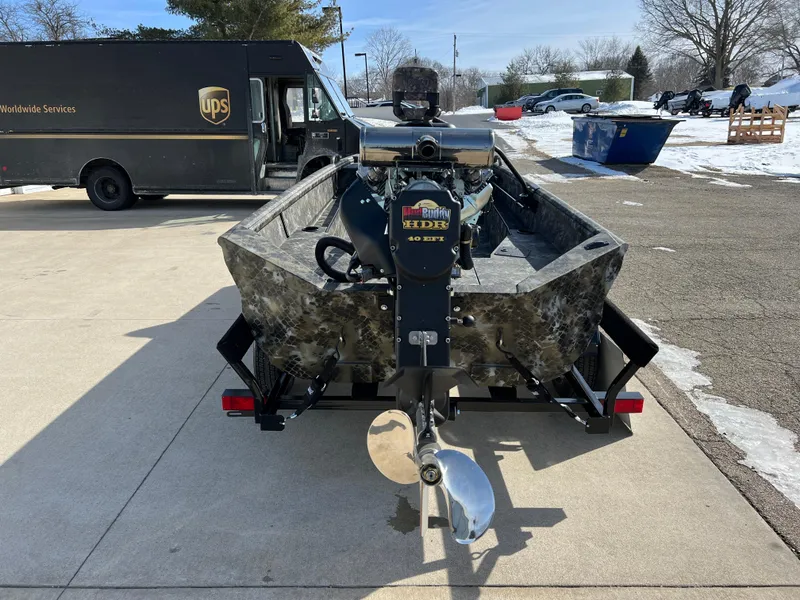 Slide: The Image of 2025 Excel Eclipse boat with HDRX motor on a trailer, parked near a UPS truck. - 6