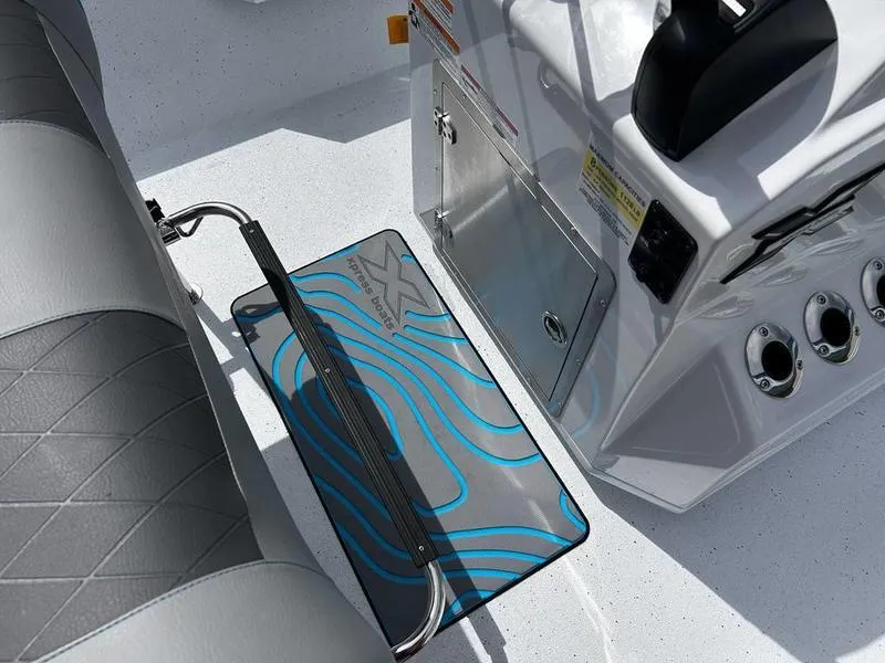Slide: The Image of Interior of 2025 Xpress H20B boat showing seating and control panel details. - 11