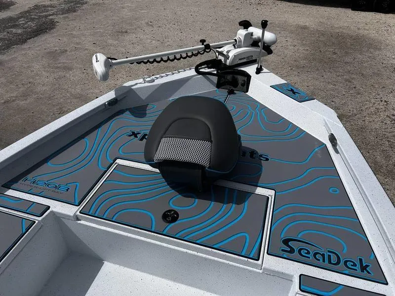Slide: The Image of 2025 Xpress H20B boat deck with SeaDek flooring and trolling motor. - 16