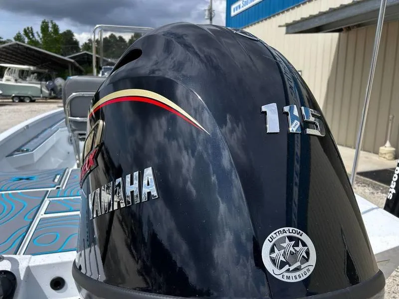 Slide: The Image of 2025 Xpress H20B boat with Yamaha 115 engine, ultra-low emission. - 21